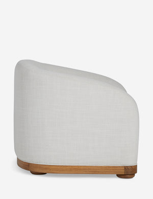 Side view of the Marci off white low barrel design accent chair