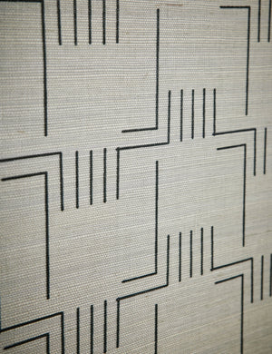 Close up view of the patter of the Mesa Grasscloth Wallpaper by Élan Byrd.