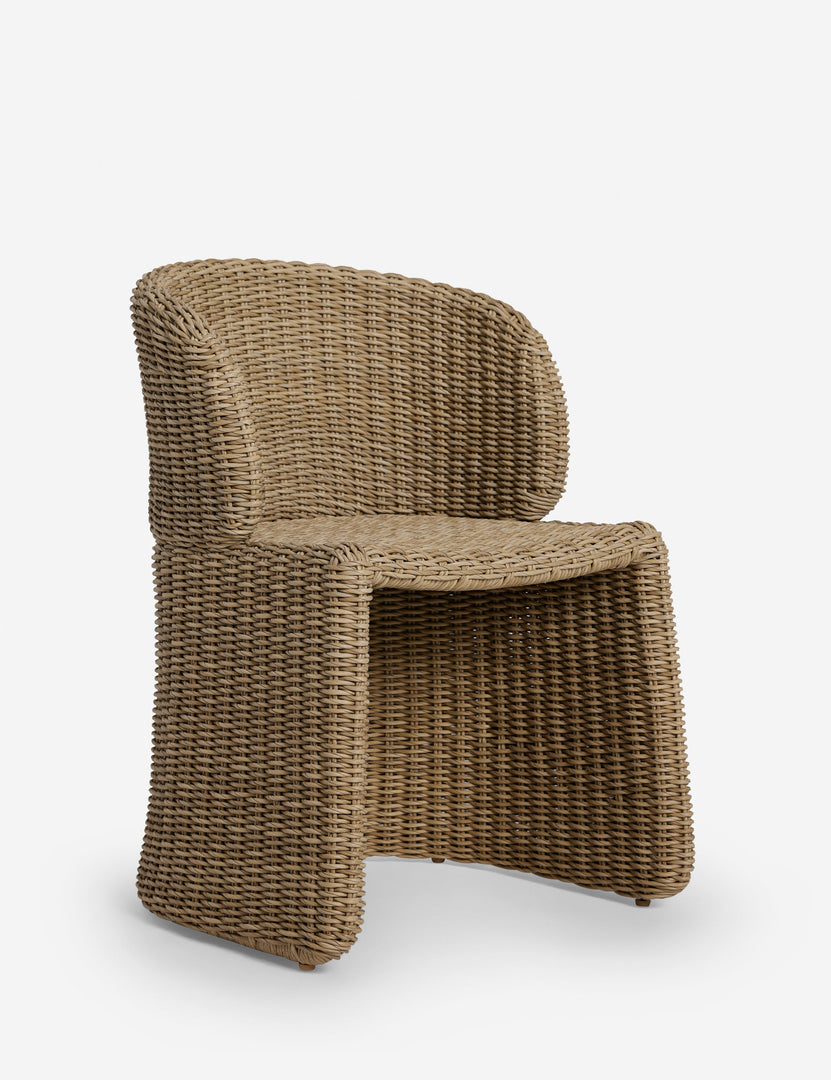 #color::natural | Angled view of the Mettam modern wicker outdoor dining chair.