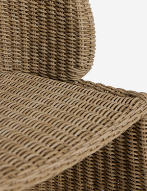 Close up of the seat of the Mettam modern wicker outdoor dining chair.