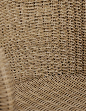 Close up of the back of the Mettam modern wicker outdoor dining chair.