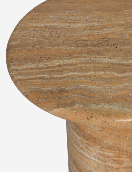 #color::Canyon-Faux-Travertine | Close up of the Mona round stone drink table.