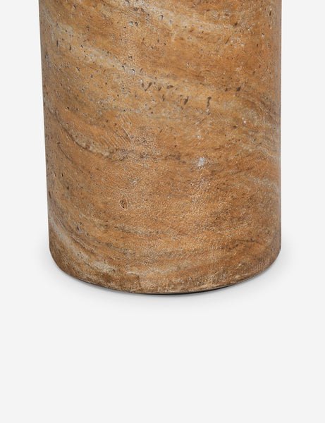 #color::Canyon-Faux-Travertine | Close up of the Mona round stone drink table.