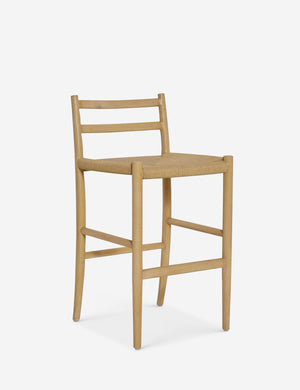 Angled view of the Nicholson slim natural oak wood frame and woven seat counter stool.