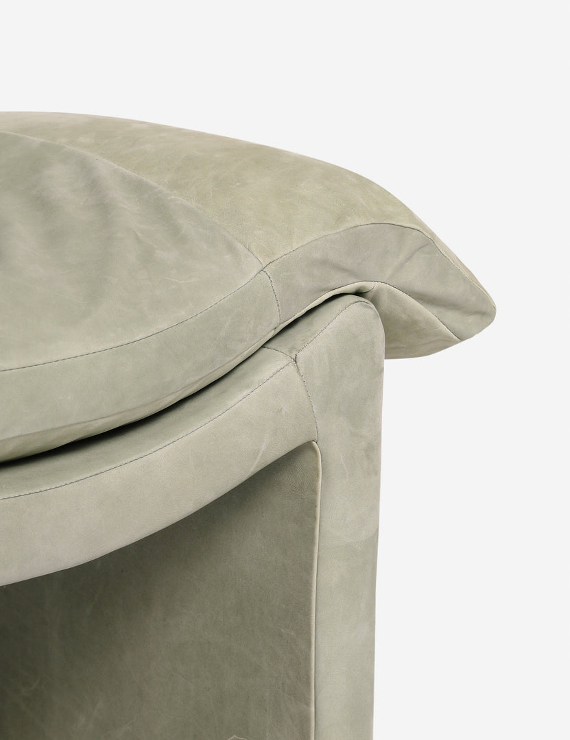 #color::sage-nubuck-leather | Close up of the Nolina relaxed open profile leather accent chair by Carly Cushnie.