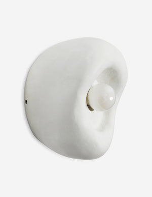 Side view of the Odette round matte white sculptural wall sconce