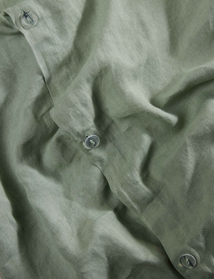 #color::lichen #size::full-queen #size::king-cal-king #type::duvet-cover #type::duvet-set | Close up view of the Essie soft, breathable hemp duvet cover in lichen green