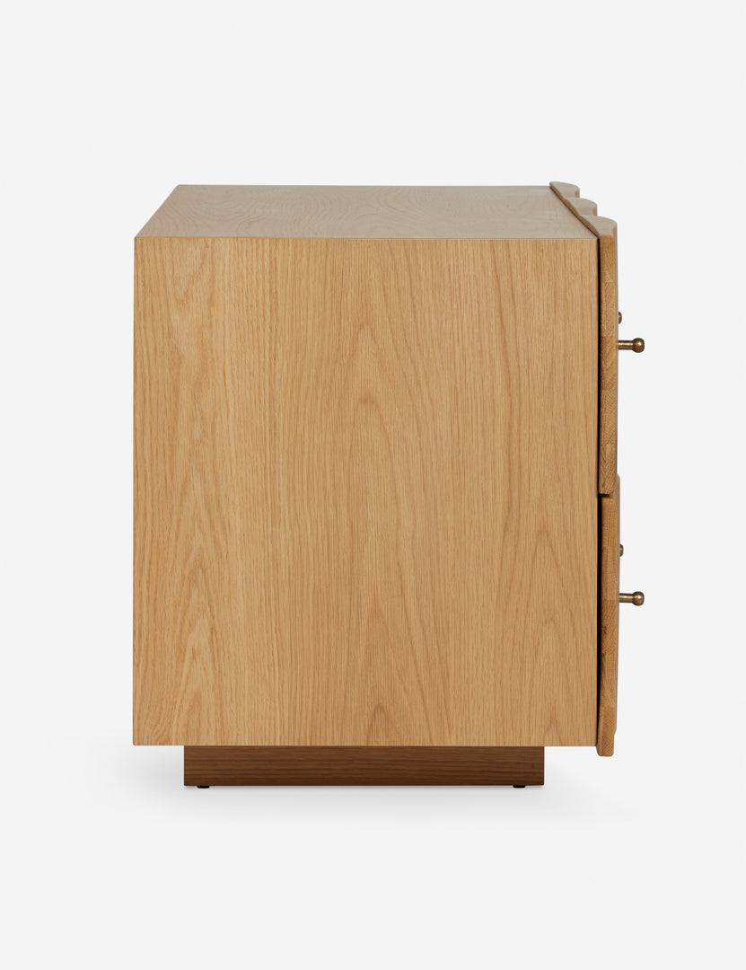 #color::natural | Side view of the Otelia wide profile two drawer nightstand in natural wood