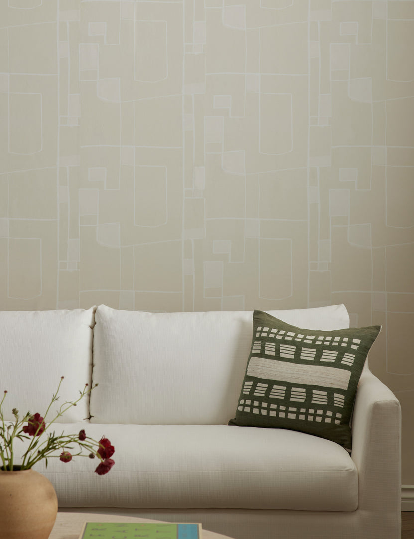#color::natural | Pathways Wallpaper by Élan Byrd on a wall behind a white sofa.