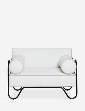Peggy sculptural iron frame and white cushion outdoor accent chair.