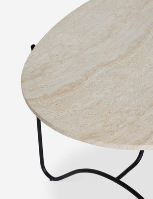 Angled overhead view of the top of the Peggy sculptural iron frame and stone top oval outdoor dining table.