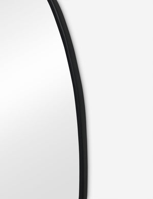 Close up view of the Puddle slim frame wall mirror in charcoal