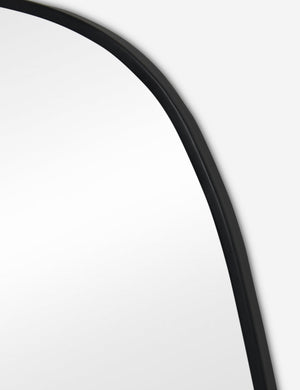 Close up view of the Puddle slim frame wall mirror in charcoal