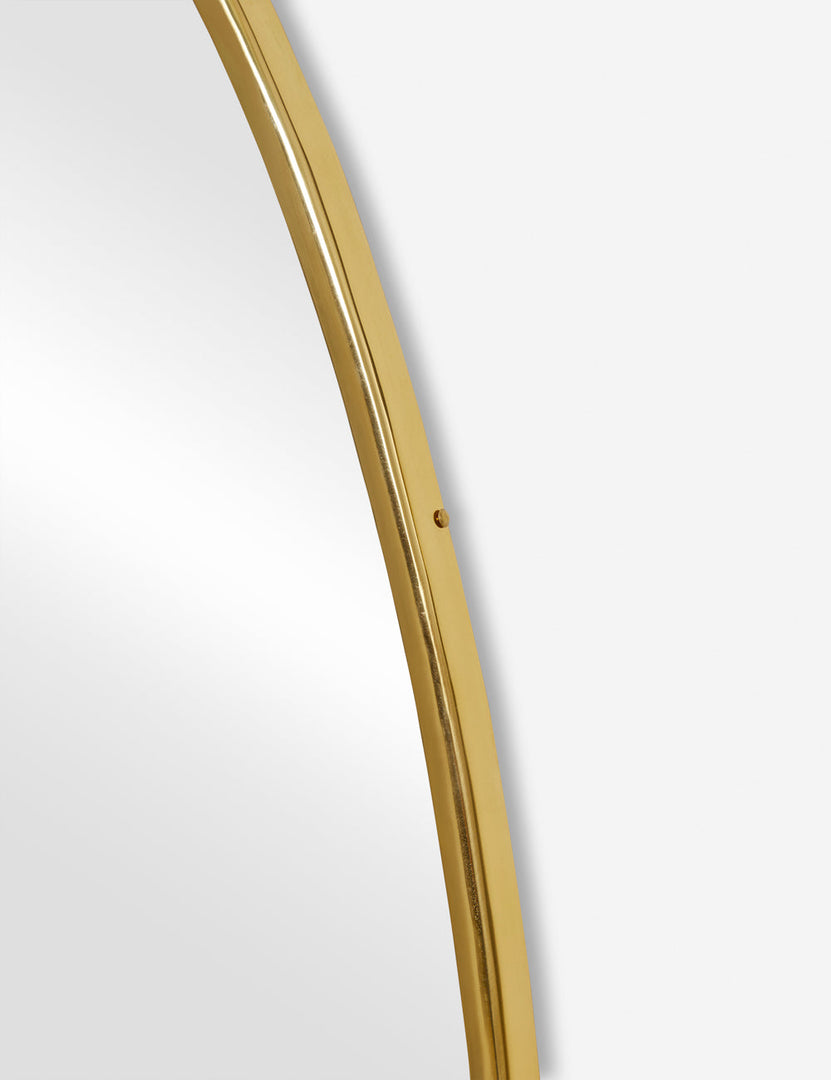 #color::gold #size::large | The gold curved frame on the large puddle mirror