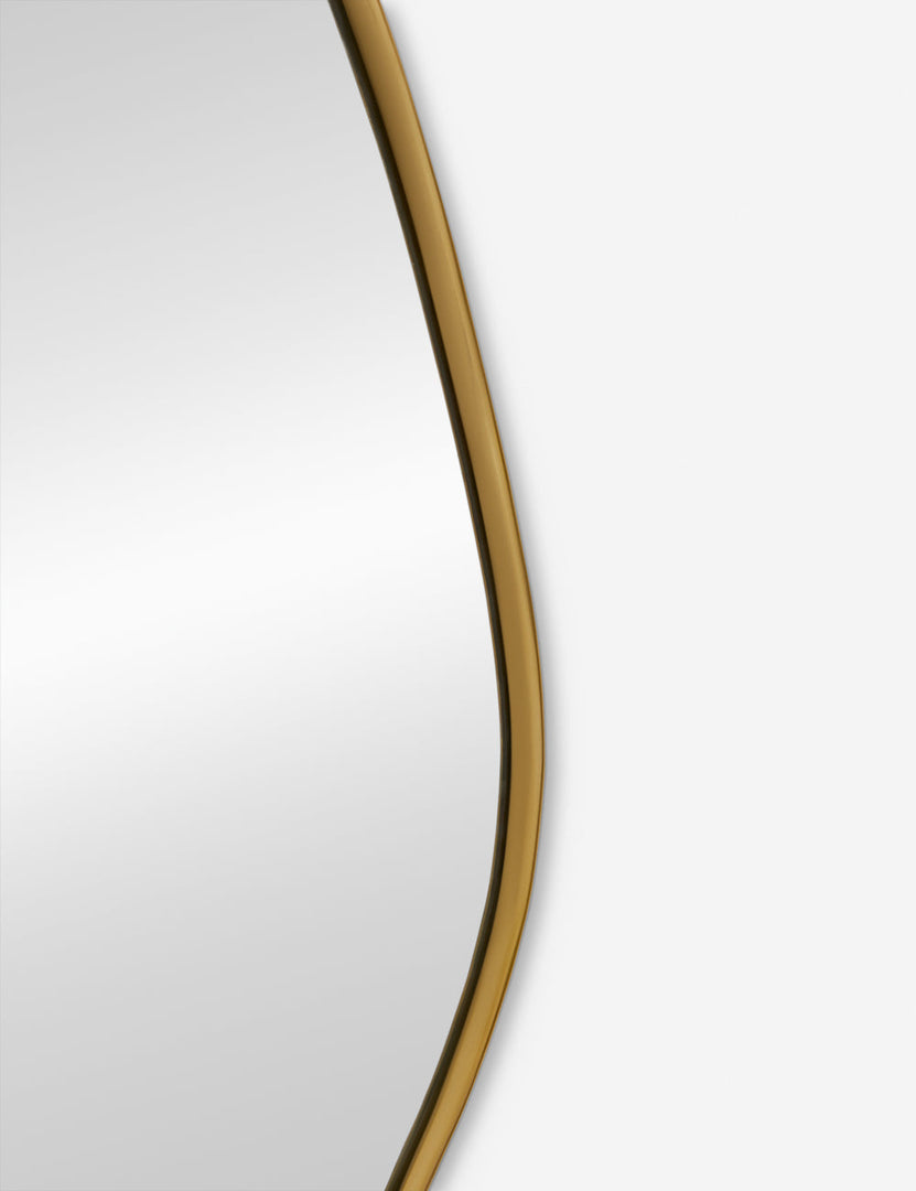  #color::gold  #size::small | The gold curved frame on the small puddle mirror