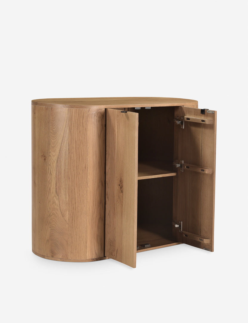| Kono 2-door curved oak cabinet with the doors open