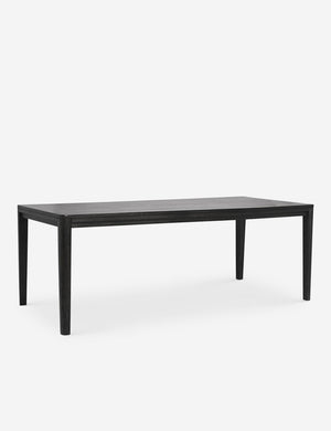 Angled view of the Reese black mango wood rectangular dining table.