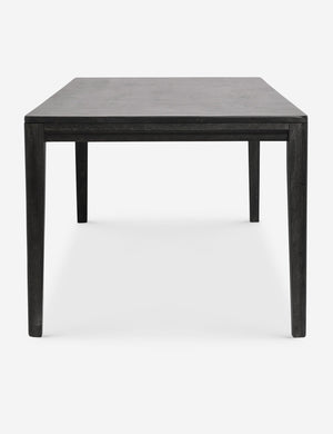 Side view of the Reese black mango wood rectangular dining table.