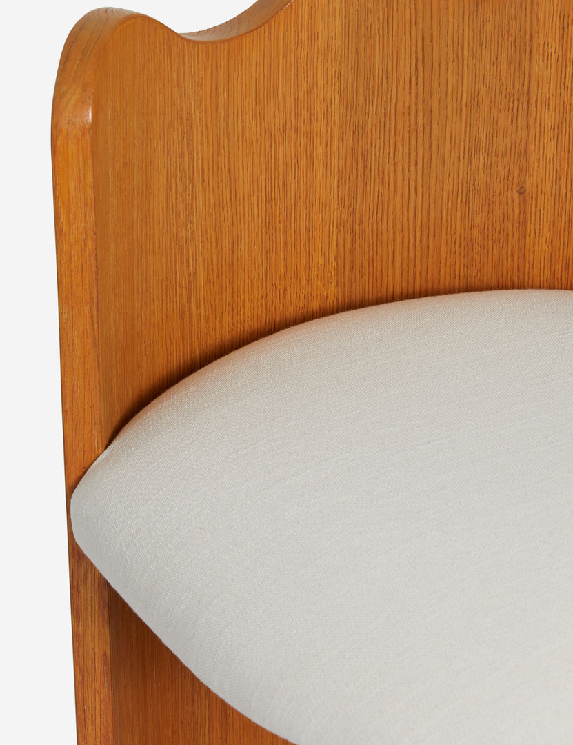 #color::honey-oak | Close up view of the Ripple wavy barrel back wooden counter stool upholstered seat