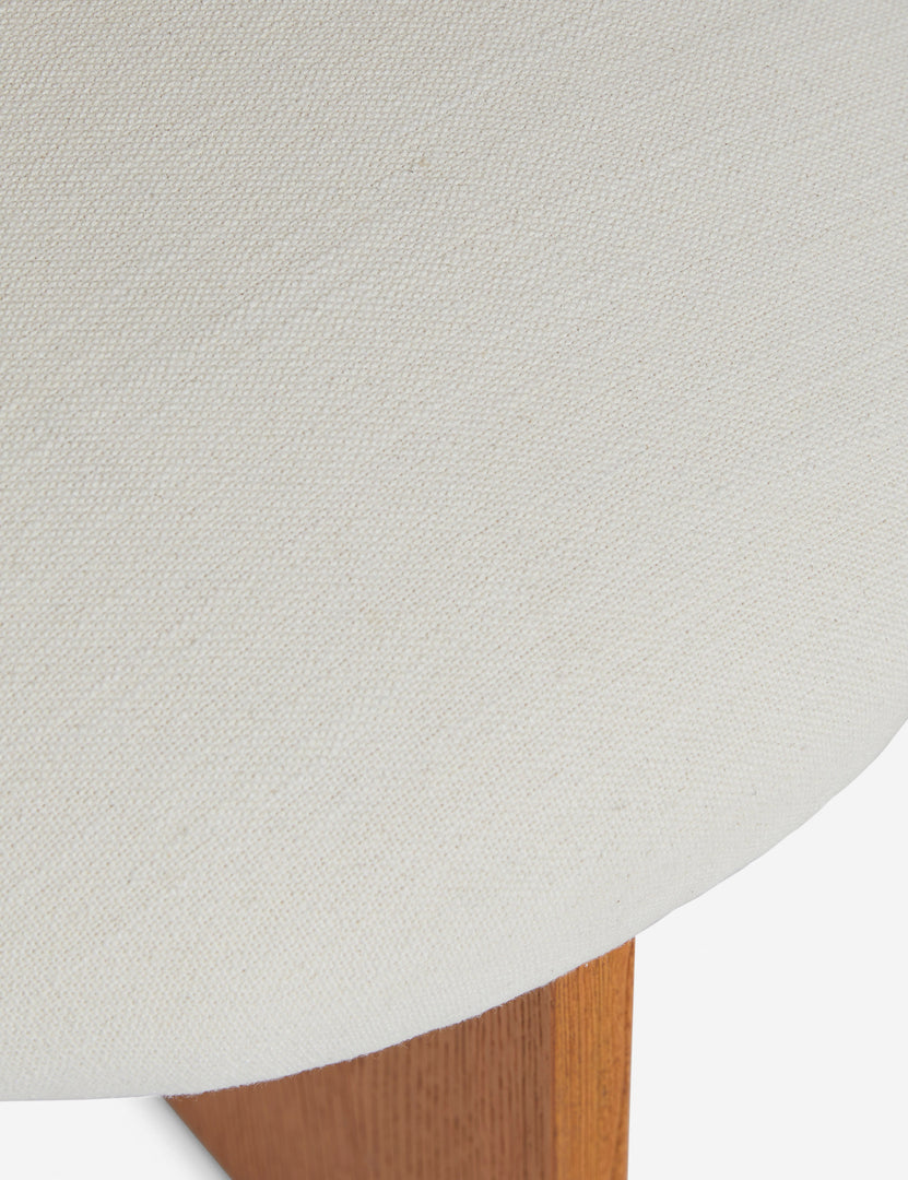 #color::honey-oak | Close up view of the Ripple tall, wavy back wooden dining chair upholstered seat