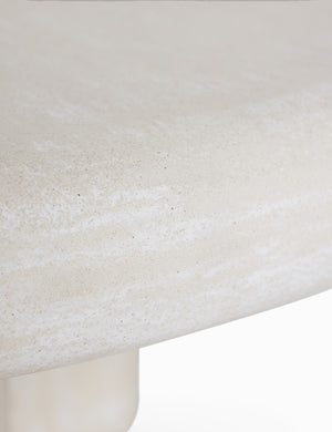 Close up of the Ruiz round cement outdoor coffee table.