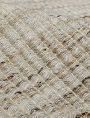 Close up of the Sabriel handwoven large-scale striped fringed outdoor rug.