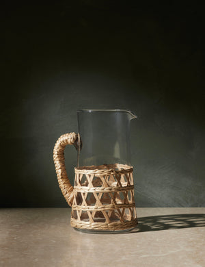 Shelly glass pitcher with natural seagrass accent