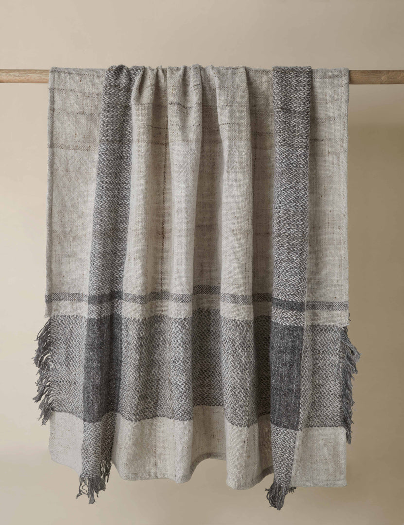 | Sidle heathered plaid fringed outdoor throw blanket hanging.