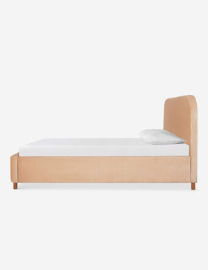 Side of the Solene buff pink velvet platform bed