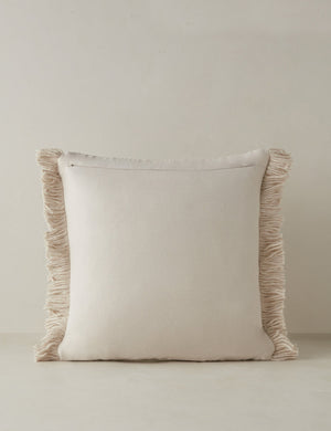Back of the Thorpe chunky woven fringed outdoor throw pillow in ivory.