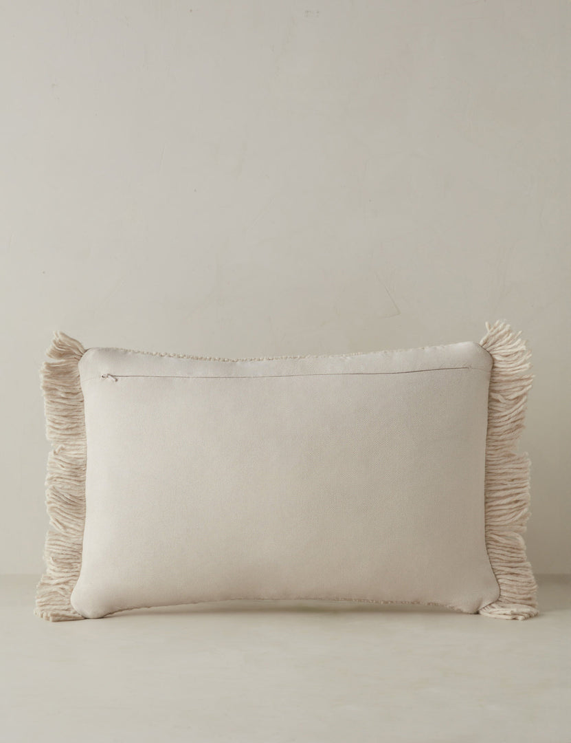 #color::ivory #style::lumbar | Back of the Thorpe chunky woven fringed outdoor lumbar pillow in ivory.