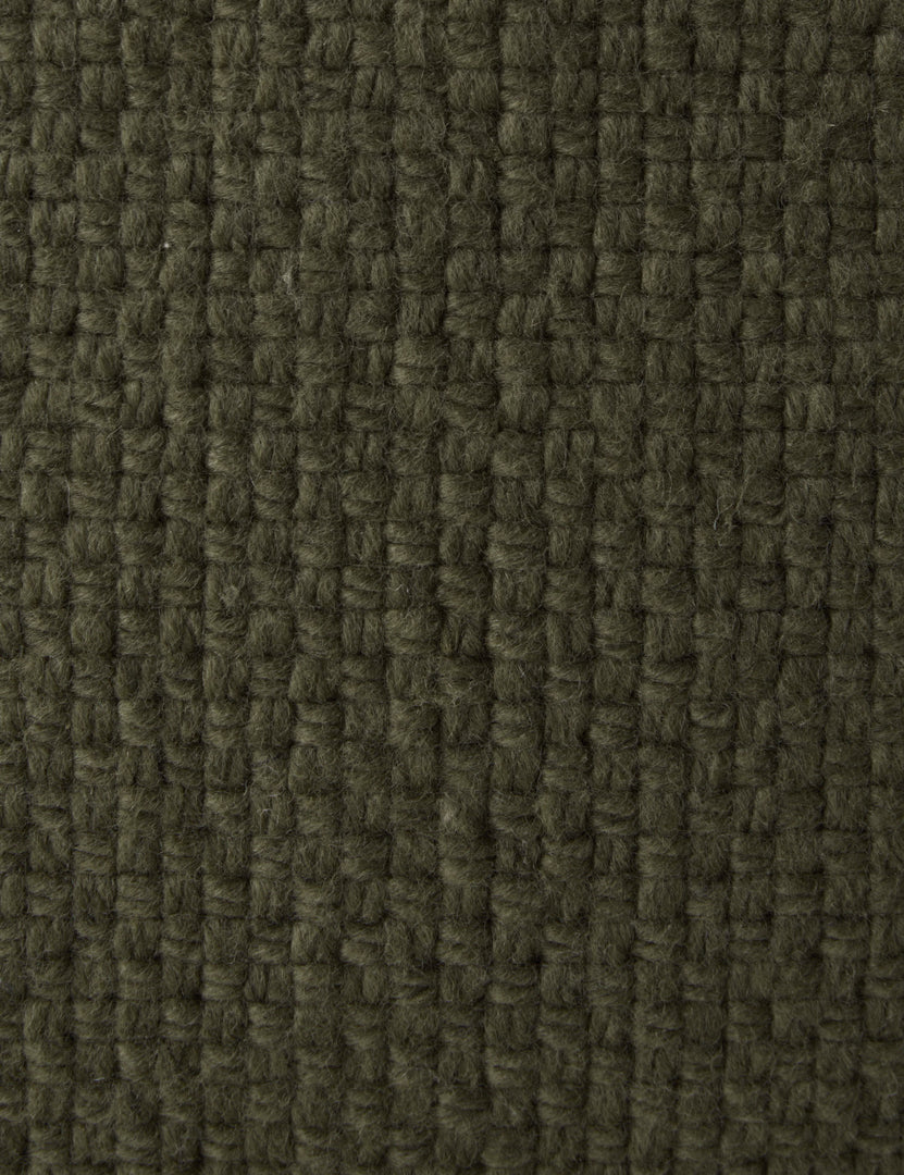 #color::moss #style::square #style::lumbar | Close up of the Thorpe chunky woven fringed outdoor pillow in moss.