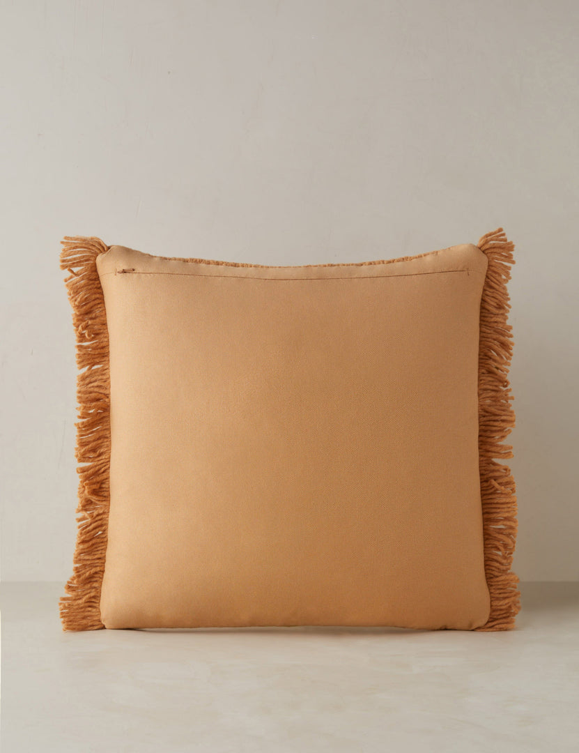 #color::terracotta #style::square | Back of the Thorpe chunky woven fringed outdoor throw pillow in terracotta.