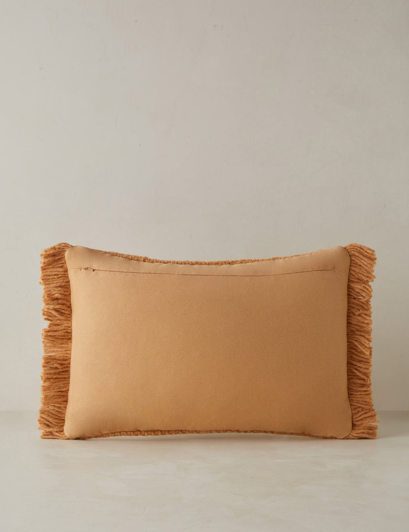 #color::terracotta #style::lumbar | Back of the Thorpe chunky woven fringed outdoor lumbar pillow in terracotta.