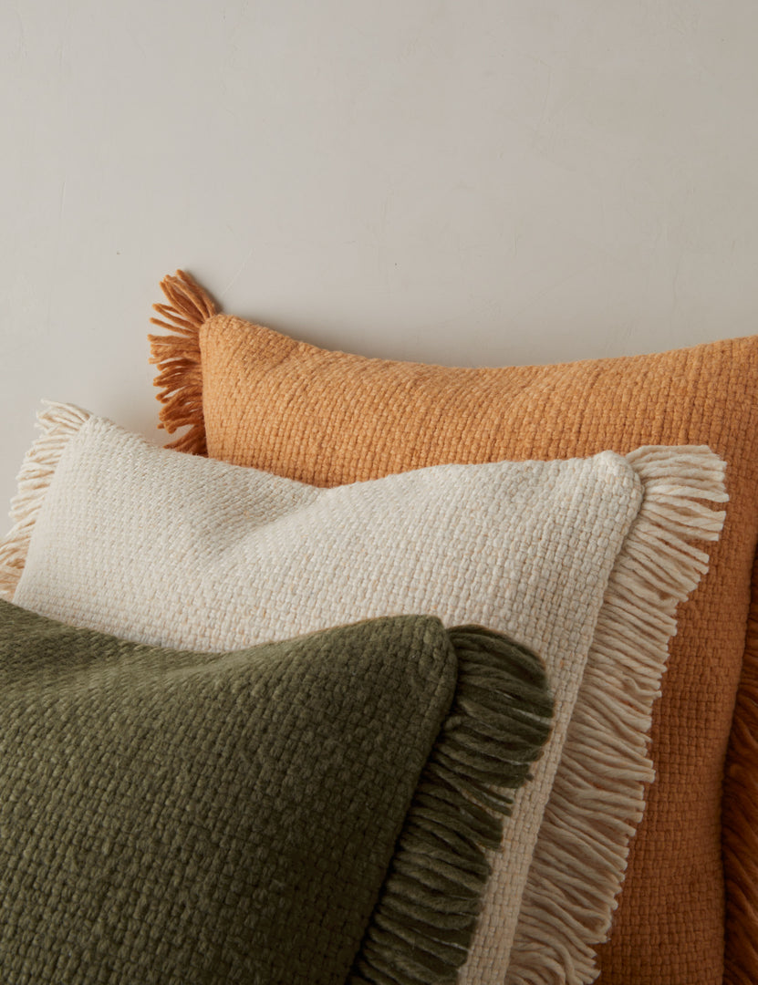 #color::terracotta #color::ivory #color::ivory #style::square | All three colors of the Thorpe outdoor throw pillow together.