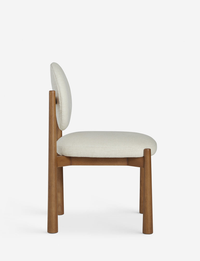 #color::ivory-basketweave | Side profile of the Truett modern dining chair.