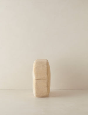 Side view of the Velvet clover shaped accent pillow in light beige