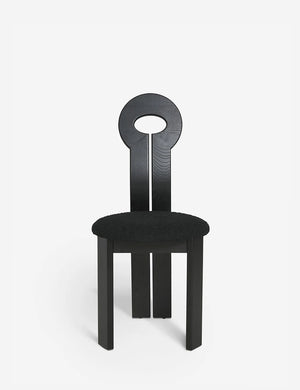 Close-up of the eyelet-style back on the Whit black wood sculptural dining chair by sarah sherman samuel