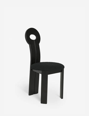 Angled view of the Whit black wood sculptural dining chair by sarah sherman samuel