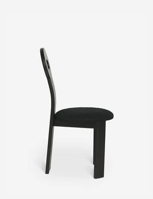 Side view of the Whit black wood sculptural dining chair by sarah sherman samuel