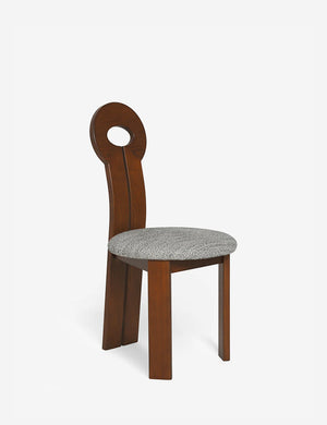 Angled view of the Whit honey wood sculptural dining chair by sarah sherman samuel