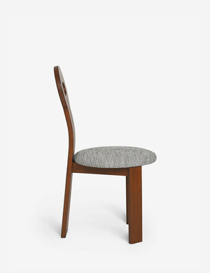 Side view of the Whit honey wood sculptural dining chair by sarah sherman samuel