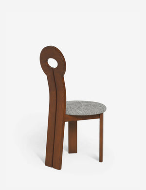 Angled rear view of the Whit honey wood sculptural dining chair by sarah sherman samuel
