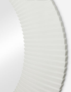 Close up of the Whitaker white asymmetrical oval wall mirror.