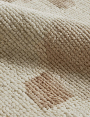 Close up of the Yana hand-knotted organic pattern wool rug.