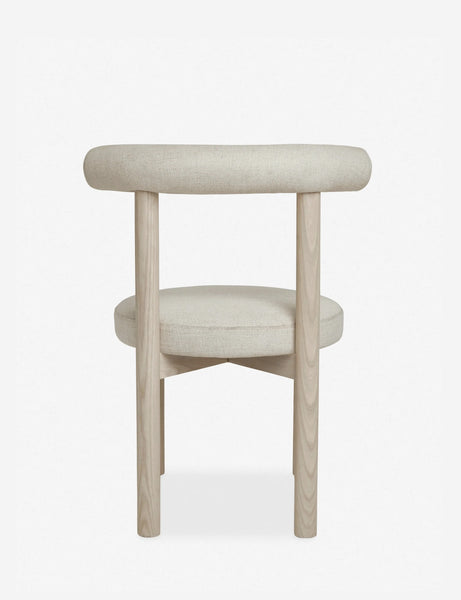 #color::whitewash | Rear view of the Dame minimalist rounded open-back dining chair with ivory upholstered seat and ash wood frame