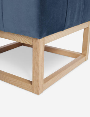 Close up of the airy wooden frame on the bottom of the Grasmere Harbor Blue Velvet Ottoman