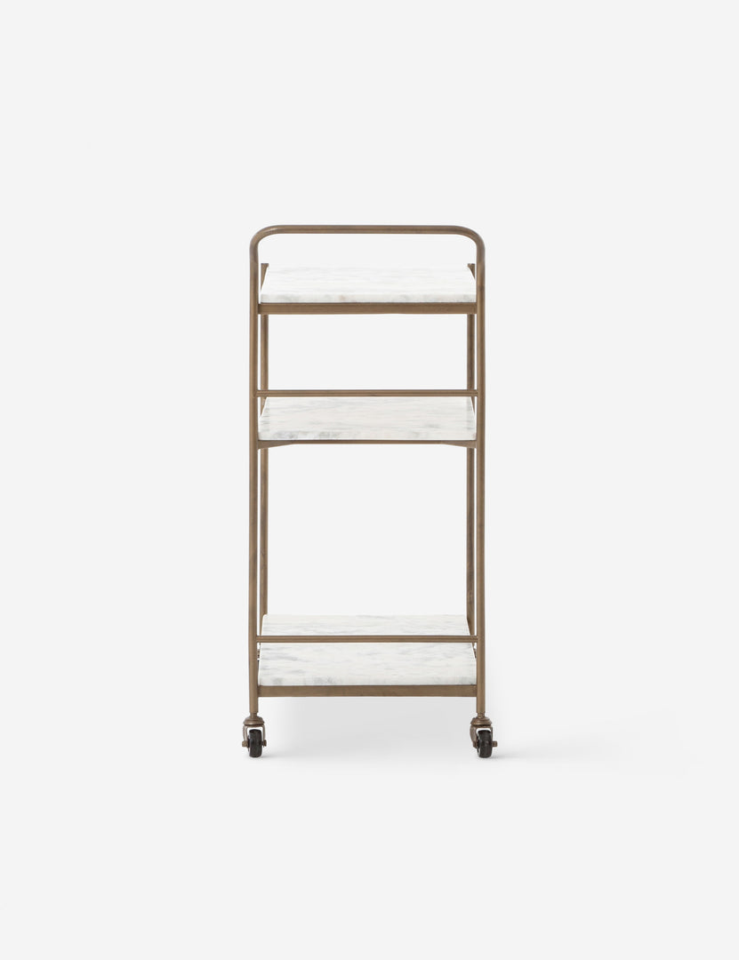 #color::antique-brass | Side view of the Evander brass frame and white marble bar cart.