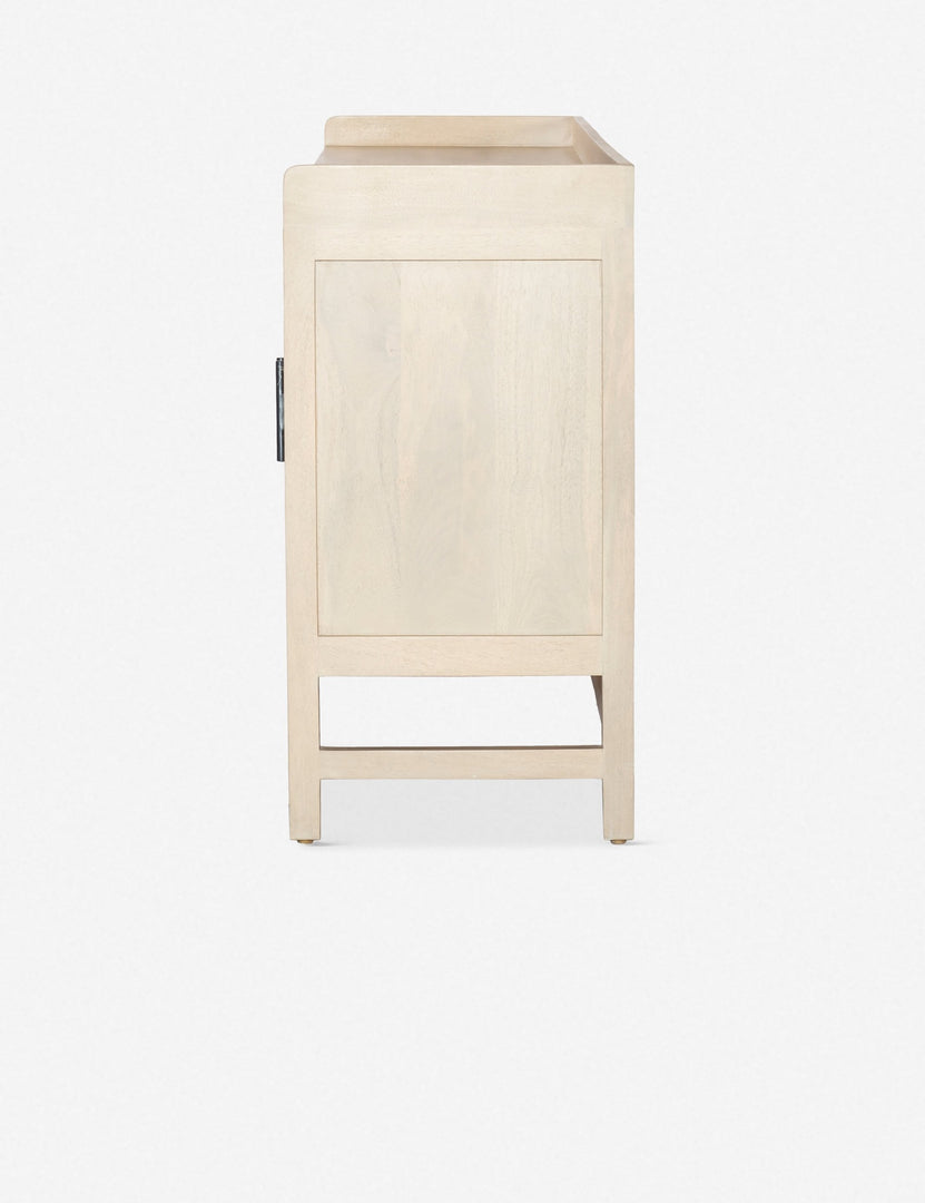 #color::natural | Side view of the Philene natural mango wood sideboard with cane doors