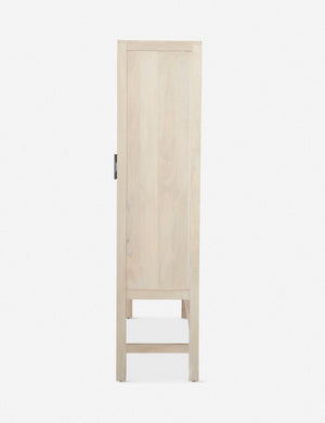 Side view of the Hannah whitewashed mango wood cabinet with cane doors